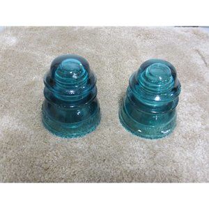 LOT OF 2 VINTAGE TEAL GLASS INSULATORS WITH DEFECTS
